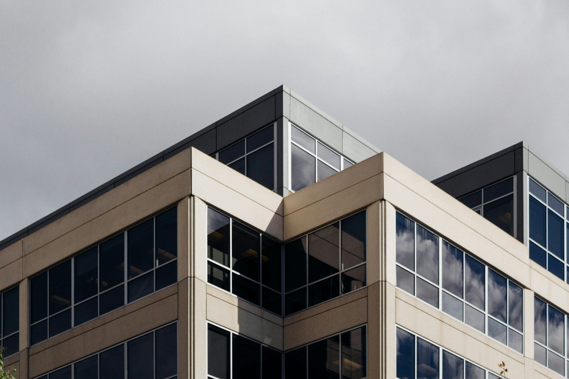 A white office facade against the sky